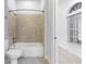 Clean bathroom with a shower/tub combo and tile surround at 5312 Meadow Hill Loop, Lady Lake, FL 32159