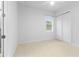 Spacious bedroom with double doors and window at 5312 Meadow Hill Loop, Lady Lake, FL 32159