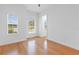 Bedroom with hardwood floors and large windows at 5312 Meadow Hill Loop, Lady Lake, FL 32159