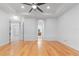 Spacious bedroom with hardwood floors and access to bathroom at 5312 Meadow Hill Loop, Lady Lake, FL 32159