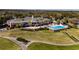 Brick clubhouse with pool and patio area at 5312 Meadow Hill Loop, Lady Lake, FL 32159