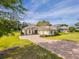 Charming home with a brick driveway, well-maintained landscaping, and inviting curb appeal at 5312 Meadow Hill Loop, Lady Lake, FL 32159