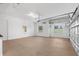 Spacious garage with ample storage, a utility door, and bright natural light at 5312 Meadow Hill Loop, Lady Lake, FL 32159