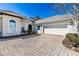 Two-car garage with paver driveway at 5312 Meadow Hill Loop, Lady Lake, FL 32159