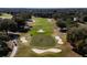 Scenic aerial view of the golf course, showcasing the lush green fairway and sand traps at 5312 Meadow Hill Loop, Lady Lake, FL 32159