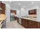 Modern kitchen with stainless steel appliances and granite counters at 5312 Meadow Hill Loop, Lady Lake, FL 32159