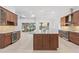 Open kitchen featuring a large island, stainless steel appliances, and granite countertops at 5312 Meadow Hill Loop, Lady Lake, FL 32159