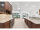 Kitchen with granite counters and wine storage at 5312 Meadow Hill Loop, Lady Lake, FL 32159