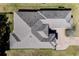 Aerial view of a house with grey roof at 5312 Meadow Hill Loop, Lady Lake, FL 32159