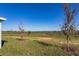 Grass backyard with a scenic lake view at 5792 Timber Meadow Way, St Cloud, FL 34771