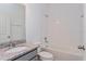 Bathroom with granite vanity and a bathtub at 5792 Timber Meadow Way, St Cloud, FL 34771