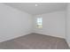 Spacious bedroom with neutral carpeting and a window offering a water view at 5792 Timber Meadow Way, St Cloud, FL 34771