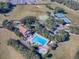 Aerial view of community pool, tennis courts, and clubhouse at 5812 Ansley Way, Mount Dora, FL 32757