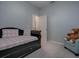 Comfortable bedroom featuring a daybed with drawers and chair at 5812 Ansley Way, Mount Dora, FL 32757