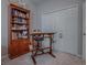 Home office with built-in wooden shelves and a standing desk at 5812 Ansley Way, Mount Dora, FL 32757