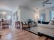 Spacious living room featuring hardwood floors and comfortable seating area at 5812 Ansley Way, Mount Dora, FL 32757