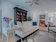 Cozy living room with light hardwood flooring and comfortable seating at 5812 Ansley Way, Mount Dora, FL 32757