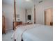 Comfortable bedroom with a four post bed and closet at 5812 Ansley Way, Mount Dora, FL 32757