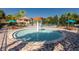 Community splash pad with an orange mushroom fountain surrounded by tables and chairs at 5812 Ansley Way, Mount Dora, FL 32757