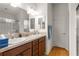 Double vanity bathroom with a large shower and linen closet at 5867 Marsh Ct, The Villages, FL 32163