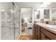 Bathroom with double vanity, large shower, and bedroom view at 5867 Marsh Ct, The Villages, FL 32163