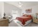Bedroom with king-size bed and decorative accents at 5867 Marsh Ct, The Villages, FL 32163