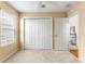 Simple bedroom with neutral walls and carpeting, featuring a large closet at 5867 Marsh Ct, The Villages, FL 32163