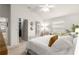 Bright bedroom with king bed, walk-in closet, and ensuite bathroom at 5867 Marsh Ct, The Villages, FL 32163