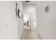 Hallway with access to bedrooms and neutral wall decor at 5867 Marsh Ct, The Villages, FL 32163