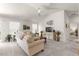 Comfortable living room with beige sofas, and a media console at 5867 Marsh Ct, The Villages, FL 32163