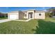 Newly constructed one-story home with a two-car garage and landscaped lawn at 610 Messina Way, Kissimmee, FL 34758