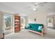 Bedroom with futon, bookshelf and large windows at 7206 Earlwood Ave, Mount Dora, FL 32757
