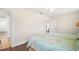 Bedroom with twin beds, hardwood floors and access to another room at 7206 Earlwood Ave, Mount Dora, FL 32757