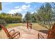 Wooden deck overlooking the backyard and trees at 7206 Earlwood Ave, Mount Dora, FL 32757