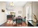 Dining room with dark wood table and chairs, view of kitchen at 7206 Earlwood Ave, Mount Dora, FL 32757