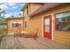 House exterior featuring a deck and rocking chairs at 7206 Earlwood Ave, Mount Dora, FL 32757
