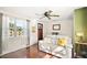 Living Room with white couch, hardwood floors, and ceiling fan at 7206 Earlwood Ave, Mount Dora, FL 32757