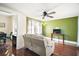 Living room with hardwood floors, white couch and ceiling fan at 7206 Earlwood Ave, Mount Dora, FL 32757