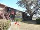 Charming home with a private screened porch and stairs to the upper level at 723 Perkins St # 104, Leesburg, FL 34748