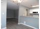 Open concept living space with views of the kitchen, dining and living room at 723 Perkins St # 104, Leesburg, FL 34748