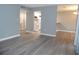 Open concept living area with views of kitchen and dining area at 723 Perkins St # 104, Leesburg, FL 34748
