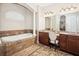 Bathroom showcasing double vanity sinks, tile floors, and large decorative rug at 1029 Juliette Blvd, Mount Dora, FL 32757