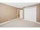 Bedroom with carpet, neutral walls, closet, and an adjacent room at 1029 Juliette Blvd, Mount Dora, FL 32757