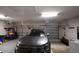 Two-car garage with storage shelving and ample space at 10300 Se 69Th Ter, Belleview, FL 34420