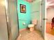 Bathroom with shower, toilet and tiled floor at 10337 Se 176Th St, Summerfield, FL 34491