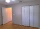 Bedroom with double door closet and hardwood floors at 10337 Se 176Th St, Summerfield, FL 34491