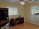 Bedroom with wood floors, desk, and built-in shelving at 10337 Se 176Th St, Summerfield, FL 34491