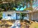 Front view of a light blue house with walkway and landscaping at 10337 Se 176Th St, Summerfield, FL 34491