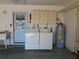 Garage with washer, dryer, and water heater at 10337 Se 176Th St, Summerfield, FL 34491