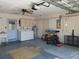 Spacious garage with washer, dryer, and ample storage at 10337 Se 176Th St, Summerfield, FL 34491